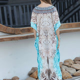 Turquoise boho maxi kaftan with exotic print, featuring lightweight fabric, short sleeves, and a flowing design, perfect as a beach cover-up or summer dress.