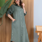 Turquoise linen dress with asymmetrical hem and long sleeves, designed for summer wear.