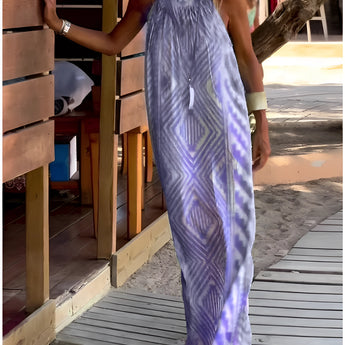 Turquoise tie-dye maxi dress in a sleeveless design, featuring a blend of purple and electric blue hues. The dress is lightweight, ideal for beachwear, and is displayed in a 3XL size.