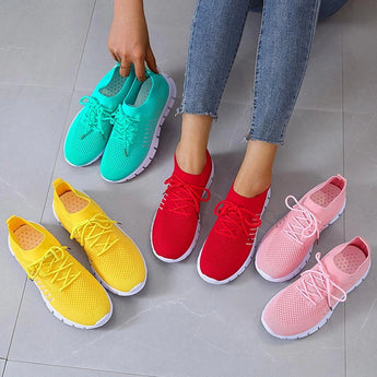 Turquoise women's breathable mesh sneakers with white and pink accents, designed for lightweight running and walking.