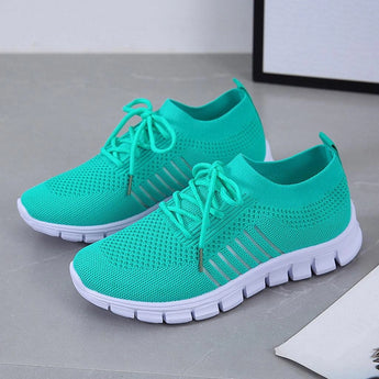 Turquoise women's breathable mesh sneakers with grey accents, designed for lightweight running and outdoor activities.