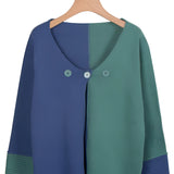 Two-tone green and blue handmade wool sweater featuring a cozy knit design, with long sleeves, a round neck, and eco-friendly materials, suitable for unisex wear.