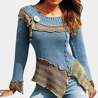 A stylish two-tone sweater featuring an asymmetrical design with ruffled details, combining green and brown colors, and complemented by a unique toggle closure.
