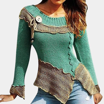 Mint green and brown asymmetrical ruffled sweater with toggle, featuring a unique two-tone design. The sweater highlights shoulder detailing, a stylish neckline, and sleek long sleeves. It is tailored for an XL fit, accentuating the waist and extending to the thigh. The textile has a textured appearance, enhancing the overall fashionable outerwear look.