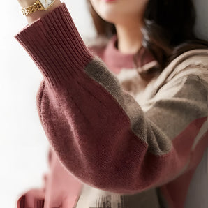 Two-tone maroon and grey women's pullover sweater with a color block design, featuring long sleeves and a comfortable fit, ideal for winter wear.