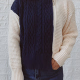 Women's two-tone chunky knit bomber jacket in white and grey with long sleeves, designed for winter fashion. The jacket features a cozy, textured knit with a comfortable fit, suitable for various body types.
