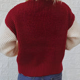 Two-tone women's chunky knit bomber jacket featuring a combination of white and grey colors, with long sleeves and a cozy, fashionable design suitable for winter wear.