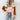 Stylish two-tone women's suede patch jacket in apricot, featuring long sleeves and a casual fit, perfect for autumn streetwear. Model is wearing size XL, accessorized with sunglasses.