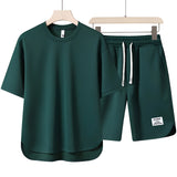 Unisex green loungewear set in size 3XL, featuring a comfortable and lightweight design suitable for summer. The outfit includes a top with a jersey-like texture, short sleeves, and a round neck.