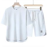 Unisex beige loungewear set in a comfortable and lightweight fabric, suitable for summer, with a white short-sleeve T-shirt and matching shorts in size 3XL.