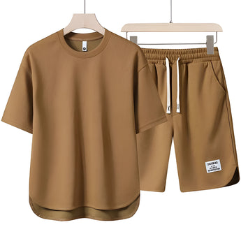 Unisex beige loungewear set in size 3XL, featuring a comfortable and lightweight design ideal for summer. The outfit includes an active shirt with short sleeves and a matching pair of active shorts.