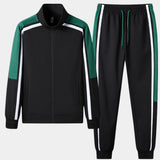 Unisex black turtleneck tracksuit set featuring a long-sleeve top and green stripe joggers, shown in size XXL.