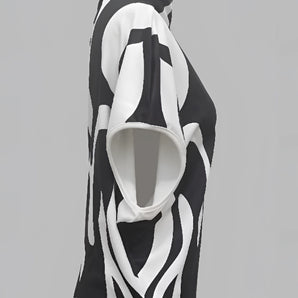 Unisex black and white geometric art hoodie showcasing modern streetwear style with bold geometric patterns.