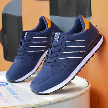 Unisex grey suede low-top sneakers in electric blue, designed for urban style and versatility, suitable for walking, cross-training, and outdoor activities.