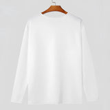 Unisex lightweight long-sleeve crewneck white t-shirt hanging on a clothes hanger.