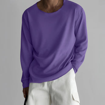 Unisex lightweight long-sleeve crewneck white t-shirt showcasing the neckline and sleeve details.