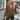 Urban Chic Brown Oversized Hooded Cape Sweater in XXL, showcasing stylish outerwear with a relaxed fit, featuring wide sleeves and a hood, worn by a model accessorized with sunglasses.