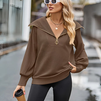 Urban Chic Brown Oversized Hooded Cape Sweater in XXL, showcasing stylish outerwear with a relaxed fit, featuring wide sleeves and a hood, worn by a model accessorized with sunglasses.