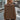 Urban Chic Brown Oversized Hooded Cape Sweater being worn by a person, showcasing its loose fit and long sleeves, with the hood draped over the shoulders, highlighting a fashionable and cozy outerwear style.