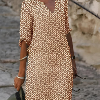 Green and white V-neck geometric print loose fit summer dress with 3/4 sleeves.