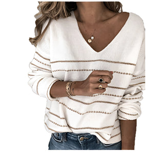 Women's V-neck striped white boho chic sweater in size 2XL, featuring a comfortable knit design perfect for fall, paired with jeans.