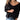 A woman wearing a black and white striped boho chic sweater with a v-neck, styled with jeans. The sweater features long sleeves and a relaxed fit, suitable for fall fashion.