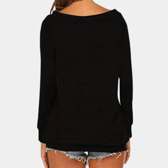 Women's black long sleeve scoop back top, styled for fall fashion, featuring a fitted design that highlights the shoulders and neckline.