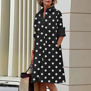 Vibrant asymmetric fuchsia and orange color block dress, featuring a one-piece design with distinct sleeve and shoulder details, suitable as a day dress.