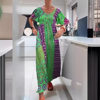 
A green, vibrant ethnic print kaftan dress designed as a bohemian beach cover-up in size 3XL, featuring a loose-fitting one-piece garment with a flowing silhouette, short sleeves, and a wide neck.