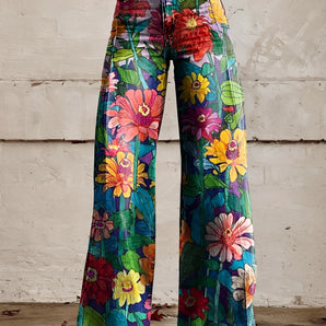 A pair of high-waisted, wide-leg bell-bottom jeans featuring a vibrant floral print with daisies, shown in size 5XL.
