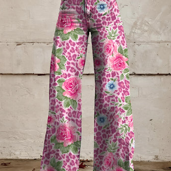 Bohemian high-waist wide-leg denim jeans in a vibrant pink floral print, featuring bell-bottom design, modeled by a person wearing 5XL.