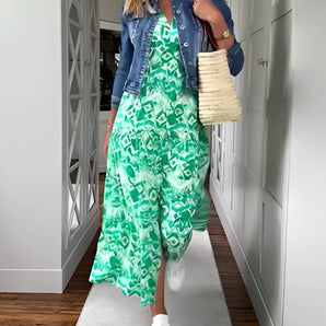 Vibrant green wide-leg jumpsuit for women, featuring a casual summer design with a sleeveless cut, relaxed fit, and elegant wide legs.
