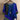 Purple patchwork boho blouse with ethnic batwing sleeves, displayed on a clothes hanger, featuring a vibrant design and wide neckline.