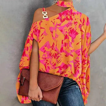 A vibrant pink-orange one-shoulder asymmetric summer blouse featuring a floral pattern, showcased in a size 2XL.