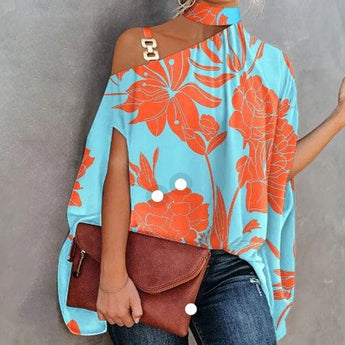 A vibrant pink-orange one-shoulder asymmetric summer blouse displayed on a white background, featuring a stylish design with a unique neckline, sleeveless on one side, and azure blue accents.