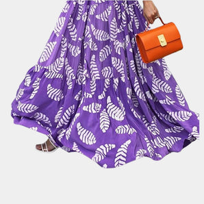 Vibrant purple leaf print maxi skirt with a boho high waist design, perfect for summer wear.