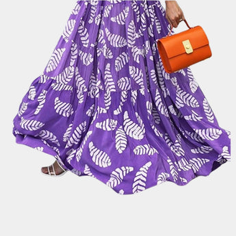 Vibrant purple leaf print maxi skirt with a boho high waist design, perfect for summer wear.