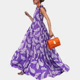 Purple leaf print maxi skirt featuring a boho high waist design, displayed in a size 2XL. The skirt's vibrant violet hue and flowing fabric evoke a summer feel, perfect for a chic and fashionable look.