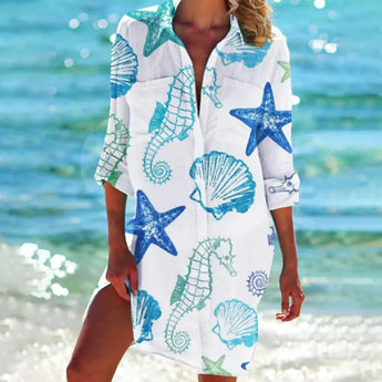 Colorful boho tunic dress beach cover-up in a vibrant tie-dye pattern, worn by a person enjoying leisure time by the water, showcasing the flowy sleeves and comfortable fit in a 3XL size.