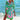 Vibrant pink tie-dye beach cover-up tunic dress with flowing sleeves and a boho style, set against a natural outdoor backdrop with hints of green and azure tones.