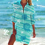 Vibrant tie-dye beach cover-up in shades of blue, designed in a boho tunic dress style. The dress features an azure and aqua color palette, with a loose fit and short sleeves, perfect for a 3XL size. 
