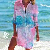 Colorful boho tunic dress in vibrant tie-dye design, predominantly pink, resembling a mermaid theme. The beach cover-up features short sleeves and an airy, relaxed fit, ideal for leisure activities by the water. Available in 3XL size, perfect for enjoying sunny days with style and comfort.