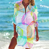 Colorful and vibrant tie-dye beach cover-up tunic dress with a rainbow shell pattern, featuring short sleeves and a waistline, suitable for wearing at the beach or in casual outdoor settings. Designed in a 3XL size, the dress exudes a boho style and is perfect for adding a splash of color to swimwear.