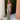 A green sheer off-shoulder maxi evening dress in XL size, featuring a watercolor pattern with vibrant hues. The dress is designed as a one-piece garment with elegant sleeves and a defined waist, ideal for daytime or evening wear.