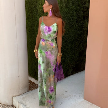 A green sheer off-shoulder maxi evening dress in XL size, featuring a watercolor pattern with vibrant hues. The dress is designed as a one-piece garment with elegant sleeves and a defined waist, ideal for daytime or evening wear.