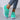 Vibrant women's lightweight neon running shoes in green, size 40, featuring breathable textile material. The shoes are styled with denim sportswear, highlighting a fashionable and sporty look.