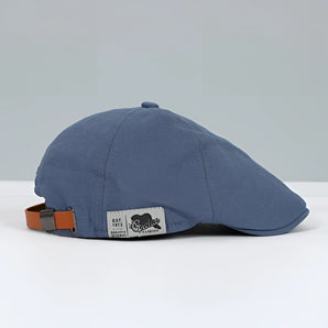 Vintage blue cotton newsboy cap with an adjustable buckle strap, in a vibrant electric blue color, suitable for one size.