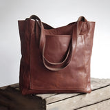 Vintage brown distressed leather tote bag, handcrafted luxury design, coffee variant, rectangular shape, shoulder strap, 50% discount.
