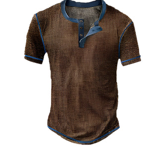 A dark brown vintage Henley men's short sleeve shirt with denim trim and contrast stitching, featuring a buttoned collar and detailed pattern, size 3XL.
