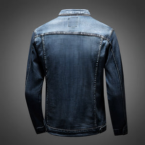Vintage men's dark wash distressed denim jacket in classic trucker style, featuring a collar and long sleeves.